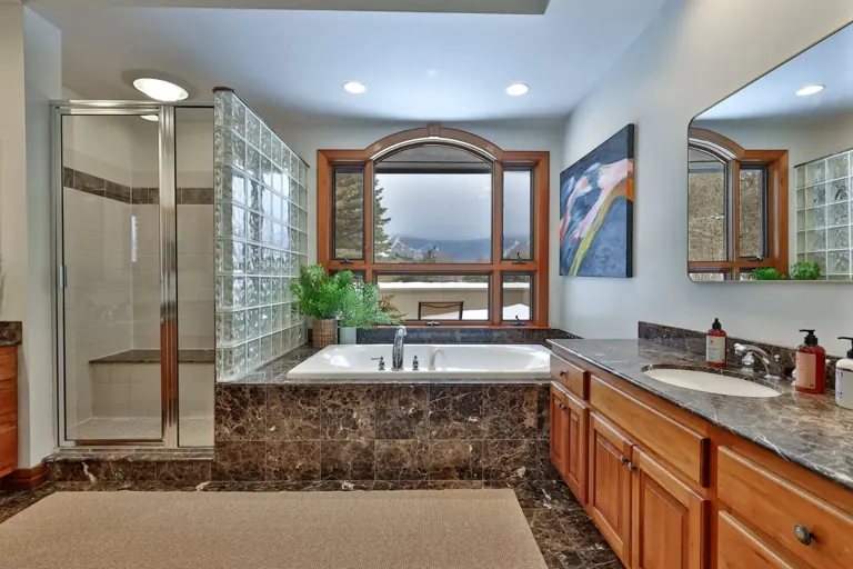 A bathroom with mountain views.