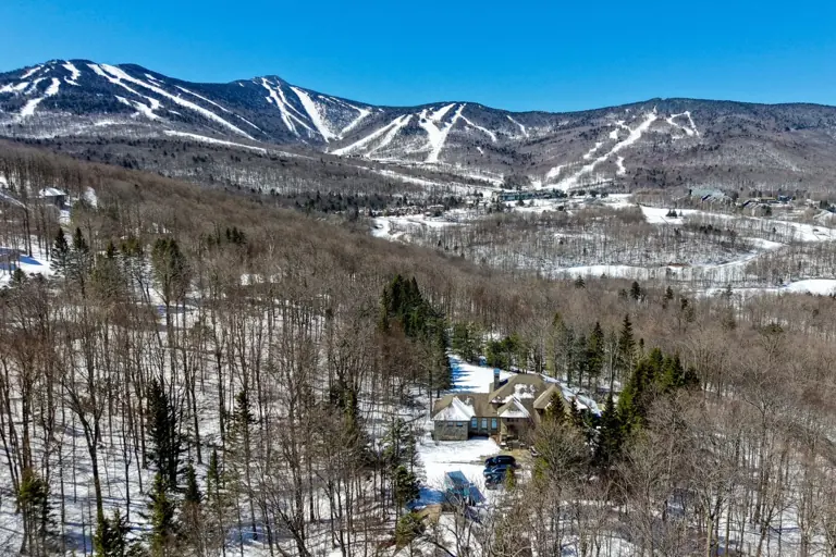 The house and Killington Mountain in winter.